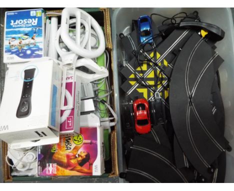 A lot to include a Nintendo Wii console, a quantity of accessories and a Wii Sports Resort game, steering wheels, controllers