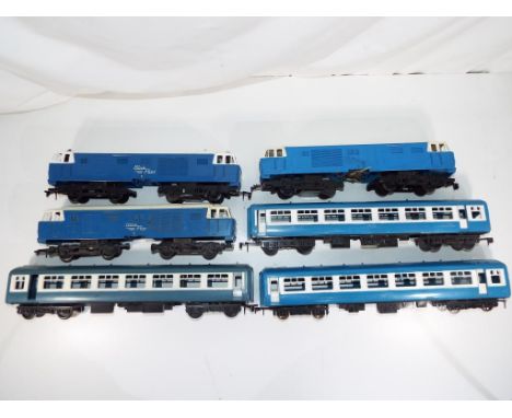 Model Railways - three battery operated Tri-ang O gauge Blue Flyer diesel locomotives with three coaches, unboxed, good playw