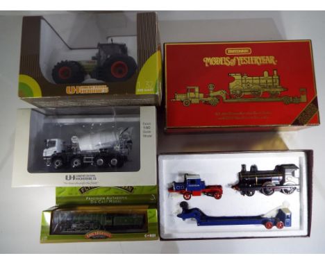 Two diecast models by Universal Hobbies, a Cifa Cement Truck in 1:50 scale, a Claas Atles 946RZ tractor in 1:32 scale, a Matc