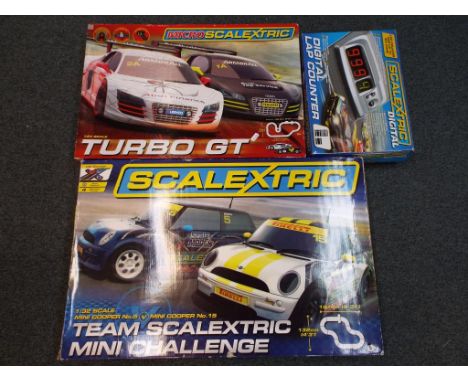 Scalextric - three sets comprising 1:64 scale turbo GT set, 1:32 scale Mini Challenge and a digital lap counter, all in origi