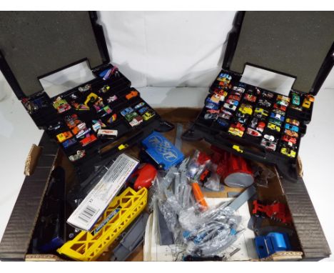 Two 1988 Lewis Galoob Micro Machines truck cases with contents, Micro Machines trap and vehicles, bell helmet, further vehicl