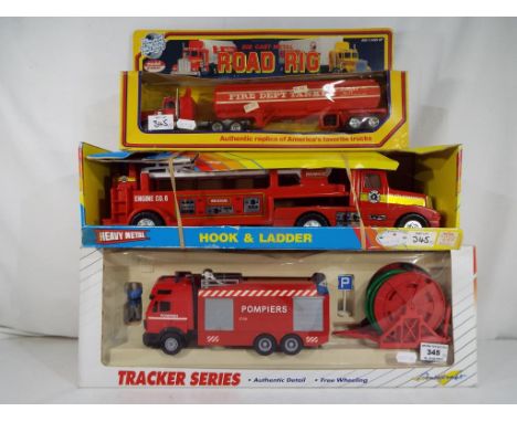 Lot to include a Remco Heavy Metal Hook and Ladder fire engine # 11331, a Truck Monster Tracker Series fire appliance  and a 
