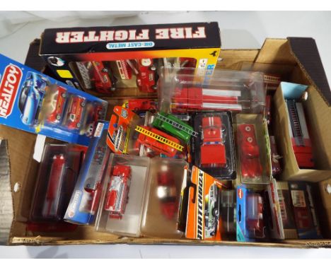 Diecast - A quantity of predominantly boxed diecast model fire vehicles to include Matchbox, Siku, Solido, Corgi and similar.