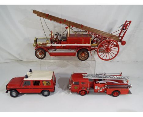 Three completed model kits of fire vehicles to include Bandai, Dennis Motor Fire Engine 1914 and similar (3)