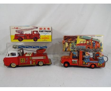 A Chinese tinplate friction powered tinplate Shanghai Fire Truck with extending ladder in original box and a Japanese Usagiya