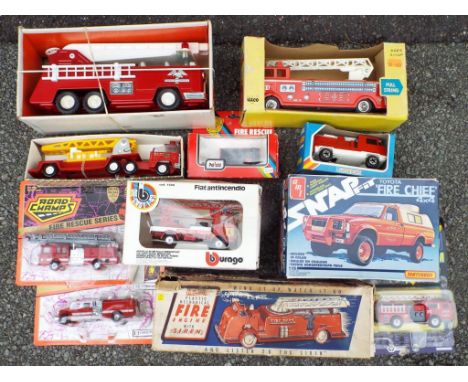 Reliable, Road Champs and others - Eleven diecast and plastic fire vehicles in original boxes and blister packs comprising Re