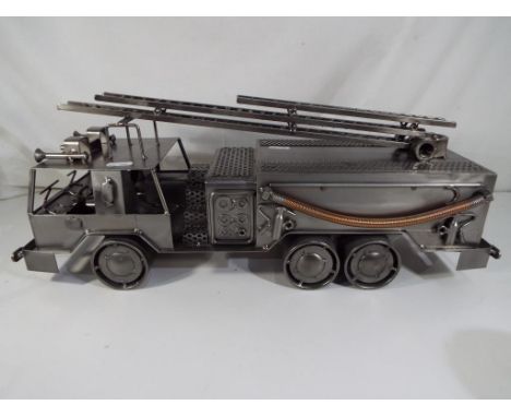A scratch built metal model of a fire engine, 50 cm (l).