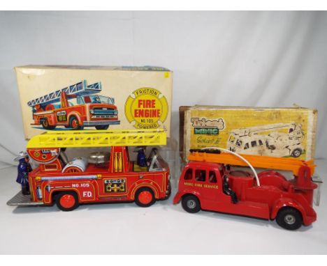 Tri-ang Minic and Usagyia - a Tri-ang Minic series two model fire fighter, plastic friction powered fire engine with extendab