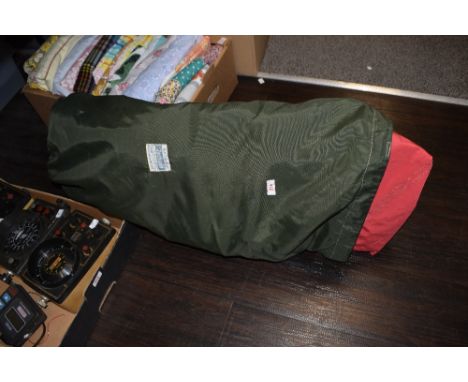 Two vintage dinghy sales, small and large, within a green sack