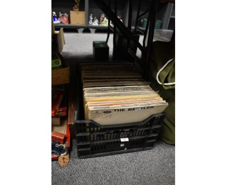 A collection of vintage vinyl records, including Birdland, Jimmy Castor (The Everything Man), The Motown Chartbusters, The Be