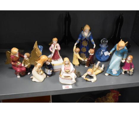 A group of seven Villeroy &amp; Boch porcelain Angell di Natale angel ornaments, and two Caithness glass perfume bottle vases