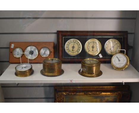 Four brass cased vintage bulk head barometers and two further ship's barometers