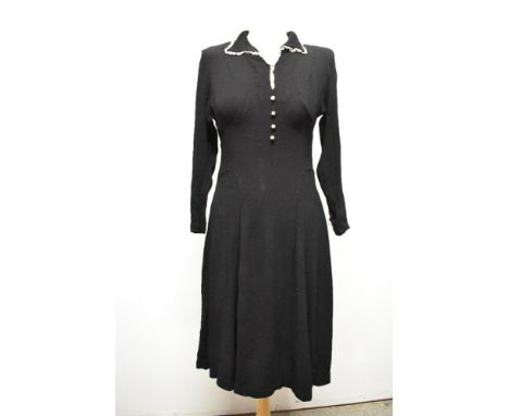 A late 1930s/40s day dress in black seersuker crepe cut on the bias, giving a lovely clingy fit, faux button detail to front,