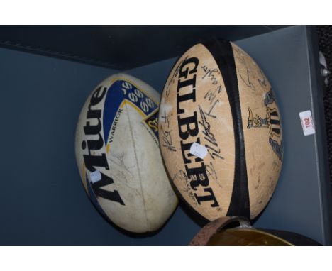 Two vintage rugby balls, including a Newcastle Rugby Club version, both having signatures