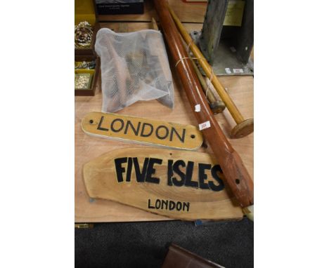 A collection of nautical treen, including a vintage rudder arm, flag poles, tying posts, and name plates for 'Five Isles' &am
