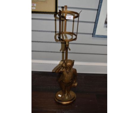 A gilt painted metal table lamp, modelled as Mr Pickwick, 'Made In England', Rd. 798010, measuring 74cm tall