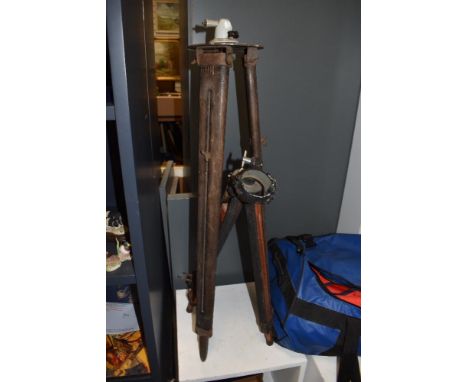 Two vintage surveyor's tripods, the largest measures 95cm tall
