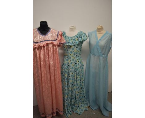 Three vintage maxi dresses, including 1970s floral dress with ruffled collar.