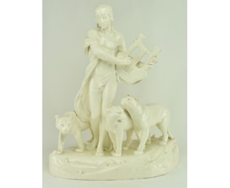 An early 20th century circa 1925 Czechoslovakian cream glazed ceramic figure Orpheus &amp; the lionesses. The sculpture depic