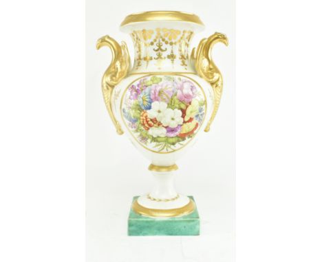 An early 19th century likely Chamberlain's Worcester porcelain urn vase. The vase with gilt flared rim, swan handles to eithe