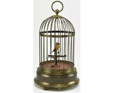 A German gilt metal bird cage automaton with single yellow mechanical bird & twisting stems. Unknown stamp to base. Measures 