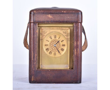A 19th century French brass cased repeater carriage clock and case. The brass case of architectural form with handle atop. Th