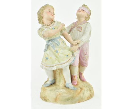 Gebruder Heubach, Germany - A continental bisque ceramic figure group of children playing. The figure depicting girl and boy 