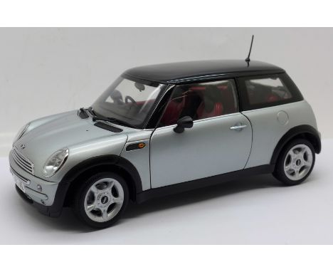 A Kyosho 1:18 scale Mini Cooper model vehicle 