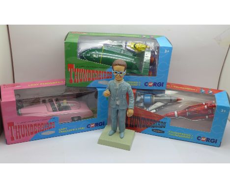 Three Thunderbirds Corgi model vehicles, Thunderbird 1/3 and 2/4, boxed and a Robert Harrop Brains figure 