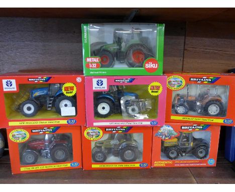Six Britains model tractors and one Siku, boxed 