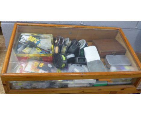 A collection of fly fishing equipment, eleven reels, flies, tying tools, etc. 