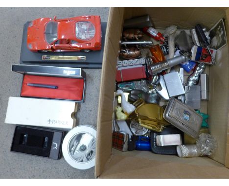 A collection of lighters and penknives and a Burago model Ferrari F40 