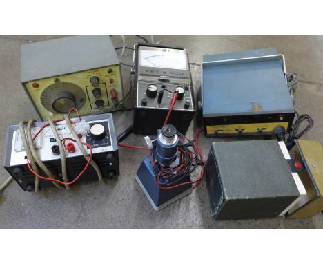 A Fet Vom K-200 meter, a Sansei 6850 sine/square wave generator, an Eagle volt meter, heath kit counter and a microscope 