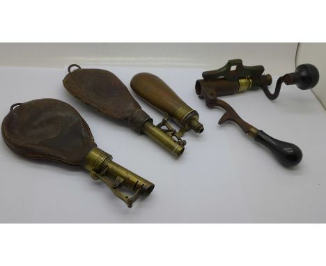 Two leather and brass shot flasks, a copper shot flask and a cartridge tool, James Dixon &amp; Sons 12 bore combination tool 