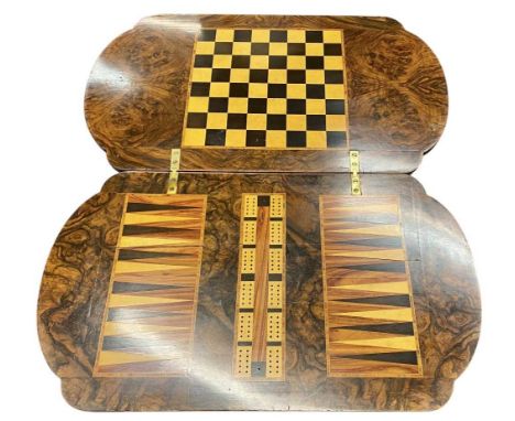 VICTORIAN WALNUT GAMES TABLE, revolving top inlaid to the underside with chess, backgammon, and cribbage boards, over a friez