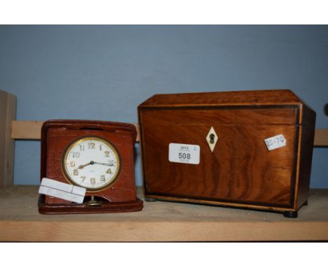 LIGHT WOOD CADDY WITH IVORY ESCUTCHEON AND A TRAVELLING ALARM CLOCK