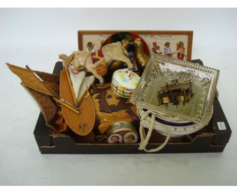 A mixed lot to include a pond yacht, a model boat, a gold painted plaster pheasant ornament, a brass clock movement etc. 