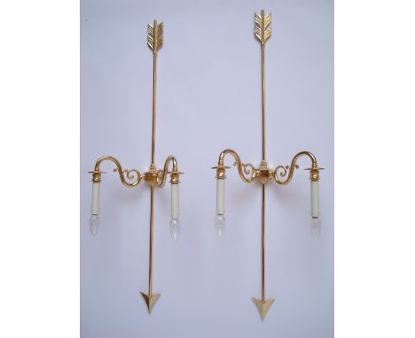 A pair of modern Italian gilt brass twin branch wall lights, each with scroll arms fitted to an arrow back plate, 108cm high.
