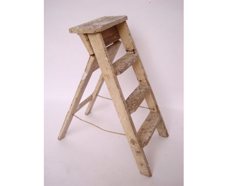 A wooden step ladder. 
