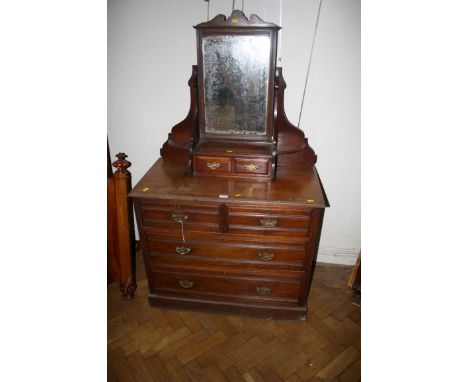 A late Victorian walnut Heals &amp; Sons mirror back dressing table, fitted two short over three long drawers