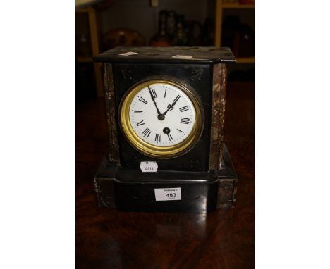 A Victorian black slate mantle timepiece, the marble column rectangular case enclosing an eight day movement faced by enamel 