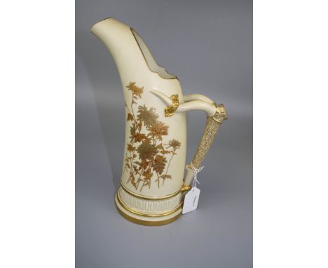 A Royal Worcester ivory ground ewer of conical form, with gilt faux bamboo handle, design number 1333