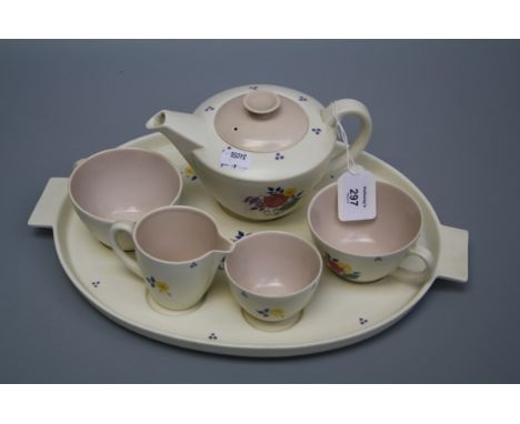 A Poole pottery tea for two on a fitted twin handled oval tray, hand decorated with floral sprays