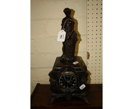 A 19th century French brown patinated mantel timepiece, the classical female surmount holding a letter beside a lamp, the squ