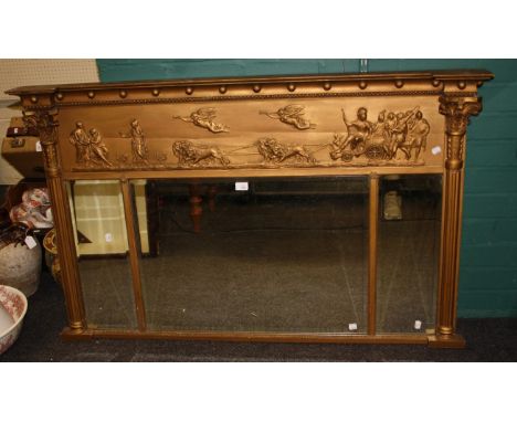 An early 19th century gilt gesso wall mirror, the inverted breakfront pediment with ball slip over a shallow relief classical