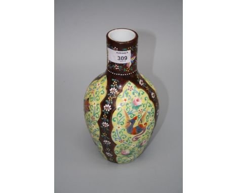 A late 19th century milk glass bottle vase, enamel decorated in the Oriental manner with panels of exotic birds and blooms on