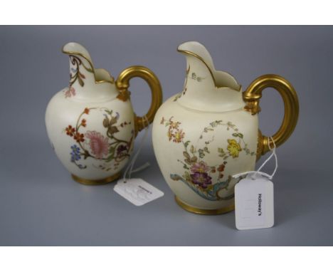 Two Royal Worcester flat back jugs, each florally decorated on an ivory and gilt ground, design number 1094, 1885, 13 and 14c