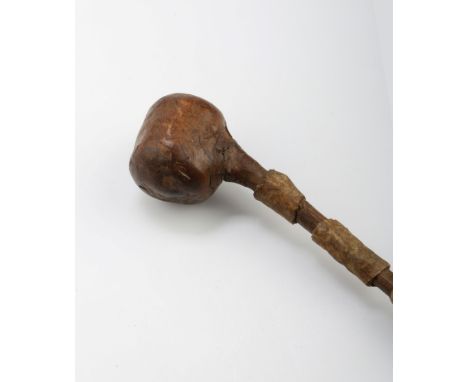 A 19th century possibly cherry wood shillelagh, with partly hide bound shaft, 62cm, together with an African stick with carve