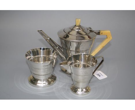 Edward Viner, a matched silver three piece tea service, each of stepped conical form, the pot with ivory finial and handle an