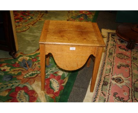 An oak commode stool.